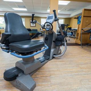 A recumbent exercise bike in a fitness center.