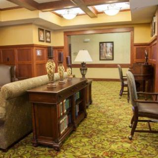 A cozy lobby area featuring a combination of comfortable seating and elegant decor.
