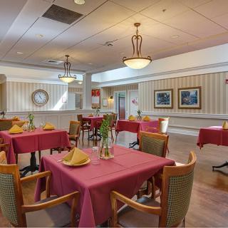 A well-decorated dining area with tables set for service.