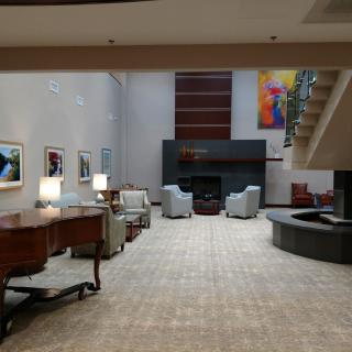 A modern lobby with comfortable seating and contemporary artwork.