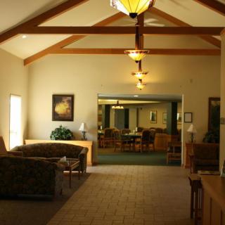 A cozy lobby area featuring a seating arrangement with sofas and warm lighting.