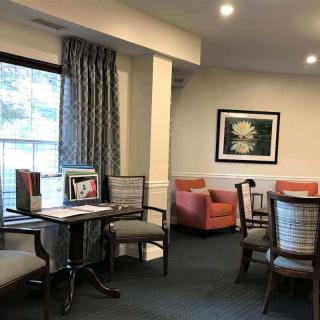 A cozy living room setup with comfortable seating and wall art.