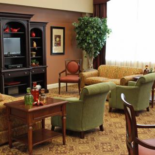 A cozy living room with comfortable seating and elegant decor.