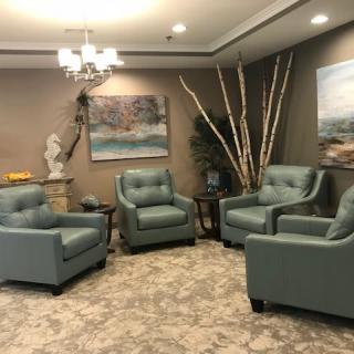 A cozy living room setup with comfortable chairs and decorative elements.