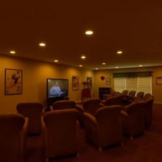 A cozy home theater setup with comfortable seating and a television.