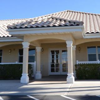 A building entrance with columns and a tiled roof.