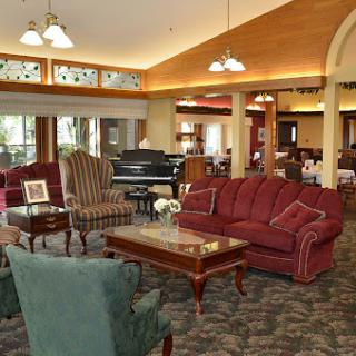 A cozy and inviting lounge area featuring comfortable seating and warm lighting.