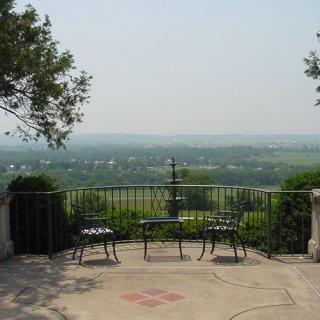 A scenic viewpoint with benches overlooking a vast landscape.