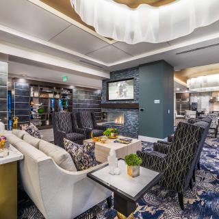 A modern and luxurious lounge area with comfortable seating and stylish decor.