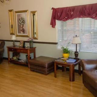 A cozy living room with comfortable seating and elegant decor.