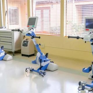 A therapy room equipped with advanced exercise machines for rehabilitation.