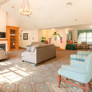 A spacious living room with comfortable seating and a cozy fireplace.