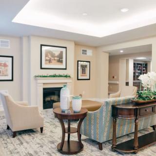 A cozy living room with comfortable seating and elegant decor.