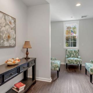 A cozy living space with elegant decor and comfortable seating.