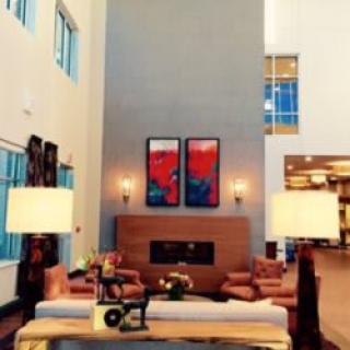 A modern living room with stylish furniture and artwork.