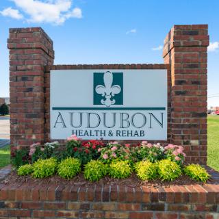 Signage for Audubon Health & Rehab, highlighting the facility's branding and landscaping.