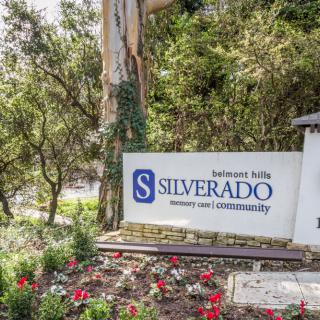 Entrance sign for the Silverado Hills community surrounded by trees and flowers.