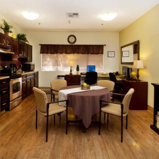 Cozy kitchen and dining area with modern furnishings and warm lighting.