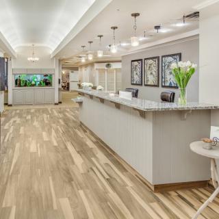Modern reception area with a sleek desk and stylish lighting.