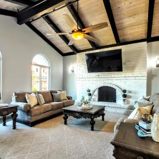 A cozy and stylish living room featuring elegant furniture and a warm ambiance.
