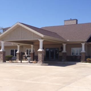 Front view of a modern commercial building with a welcoming entrance.