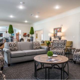 A well-furnished living room featuring comfortable seating and stylish decor.