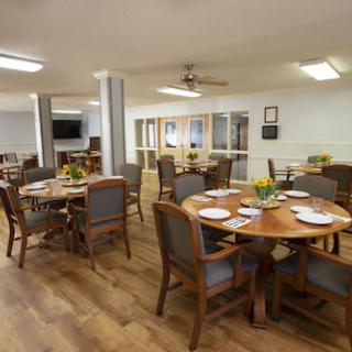 A spacious and inviting dining area with wooden tables and chairs, perfect for casual meals.