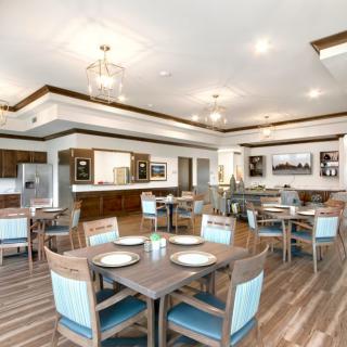 A modern dining area with elegant lighting and stylish furniture.