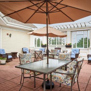 A cozy and inviting outdoor patio setup, perfect for enjoying meals or relaxing with friends.