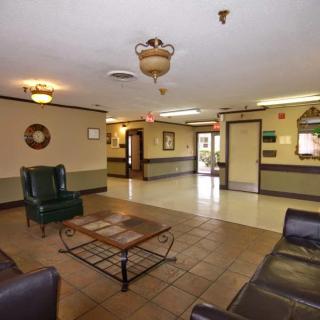 A hotel lobby with seating arrangements and a welcoming atmosphere.