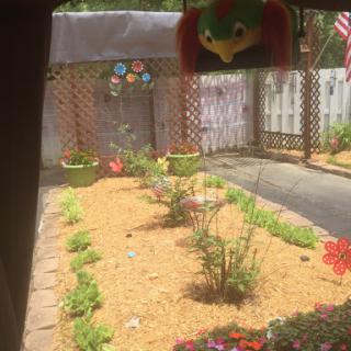 A serene garden view showcasing vibrant flowers and well-maintained landscaping.