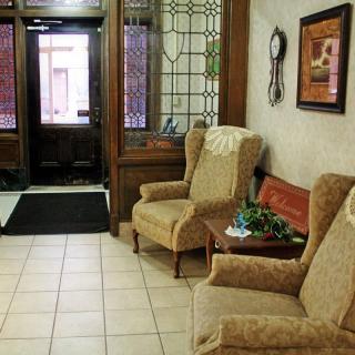 A cozy lobby area with comfortable chairs and decorative elements.