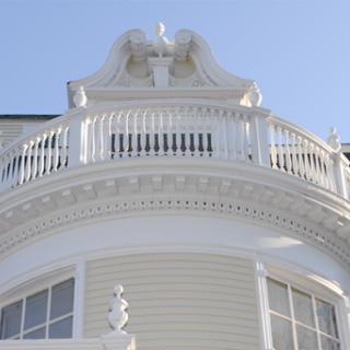 An ornate balcony showcasing intricate architectural details.