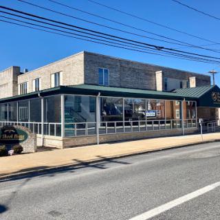 A modern commercial building captured during a clear day.
