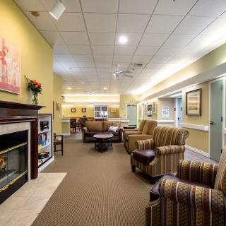 A cozy living room with comfortable seating and a fireplace.