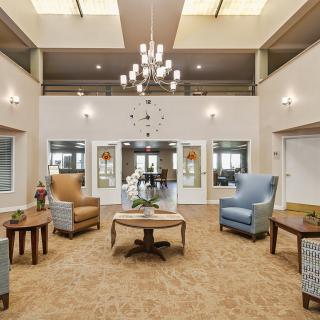 A spacious lobby area with comfortable seating and elegant lighting.