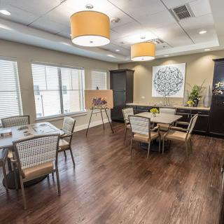 A modern dining area with stylish furniture and warm lighting.