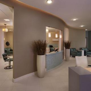 A modern interior space featuring a reception area and seating.