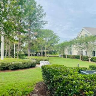A serene residential area with well-maintained gardens and lush greenery.