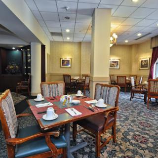 A cozy dining area with elegantly set tables, perfect for intimate meals.