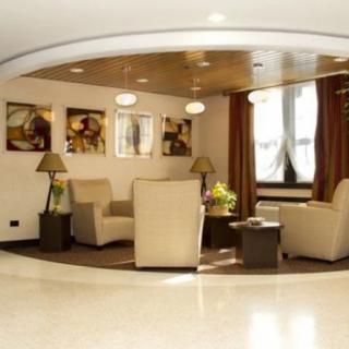 A modern lobby with comfortable seating and decorative artwork.