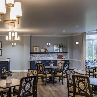 A well-decorated dining area with elegant lighting and comfortable seating.