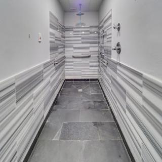 A sleek and modern hallway featuring unique textured wall panels.