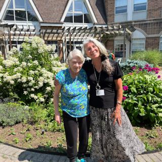 A joyful moment shared in a beautiful garden.