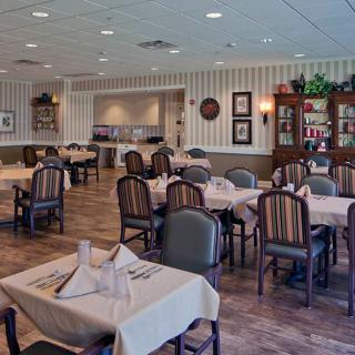 A well-arranged dining area with neatly set tables in a restaurant.