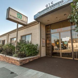 The entrance of a commercial building with signage outside.