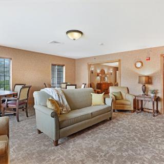 A cozy and inviting living room with comfortable seating and warm lighting.