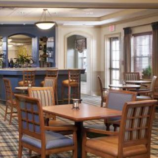 A cozy dining area with wooden furniture and a calm ambiance.