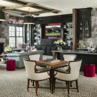 Modern living room featuring a chess table, comfortable seating, and stylish decor.