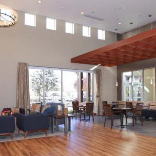 A modern lounge area with ample seating and natural light.